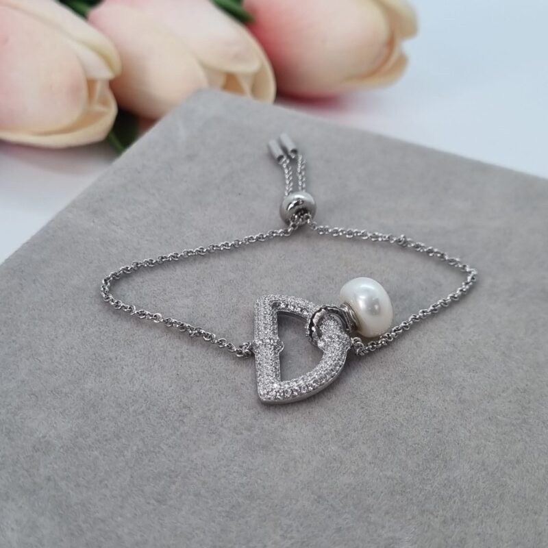 Pulsera ajustable, medio circulo circonias y perla centro,18cms - Image 2