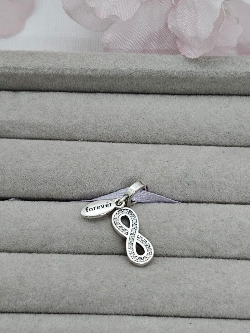 Charm infinito colgando, plata